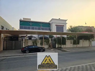 For sale: Luxurious villa, spacious, 5 master bedrooms with a swimming pool in Al Zahia, including water, electricity, and air conditioning.