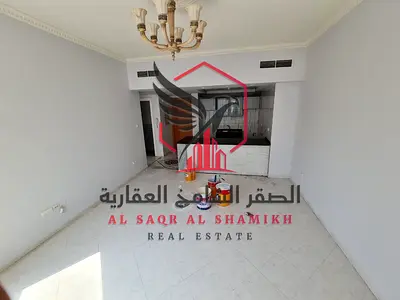 **Spacious 1-Bedroom Apartment for Annual Rent – Al Majaz 3, Sharjah.** Modern open-plan kitchen, **1 month free**, free AC, free gym & swimming pool,