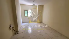 For annual rent the cheapest one bedroom apartment with a living room in Al Qasimia near the bus sta