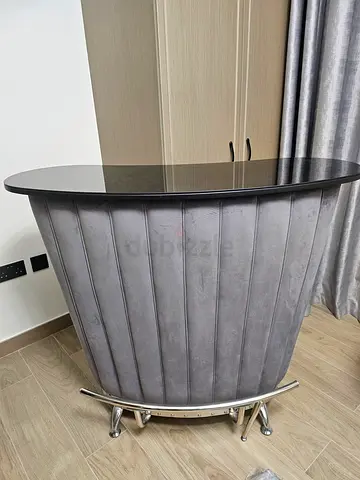 Modern grey velvet bar table with glass top and chrome base