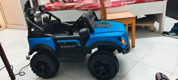 Blue Electric Ride-On Toy Truck for Kids .