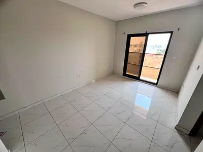 Master bedroom with balcony and built-in wardrobes in Rawda 1, directly on the main road, near Sheikh Ammar Street and opposite Kenz Hypermarket.