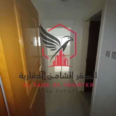 Apartment for annual rent - Al Qasimia. Spacious areas, open view, free maintenance, central air conditioning, prime location close to all services.