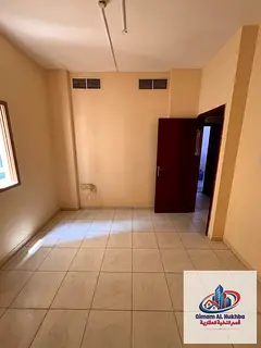 Top cheap 1BR in Al Butina, central AC/gas, free parking. Prime location, easy Dubai exit, easy paym