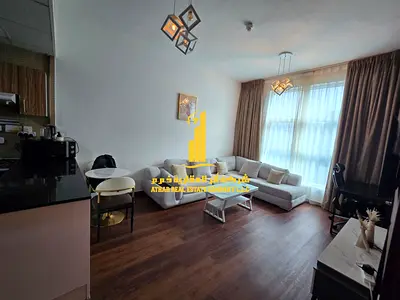 Luxury apartment, first occupancy, one bedroom and living room with a balcony and open view. Ajman City Tower. for monthly rent.