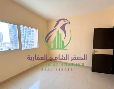 شقة غرفتين وصالة للإيجار السنوي في التعاون الشارقة مع بلكونة وباركنج مجاني داخل برج سكني مميز قريب من مخرج دبي وجميع الخدمات