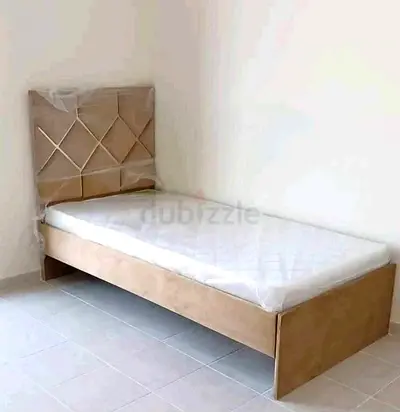 Single beige upholstered bed with mattress - good condition