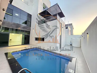 Luxury villa first occupancy 6 master bedroom with builtin wardrobes 2 living room a majlis a swimming pool an elevator and a rooftop terrace