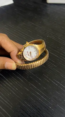 Gold-tone women's wrap bracelet watch, working condition