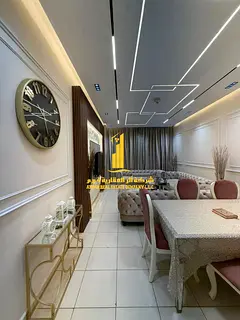 Luxury apartment, second occupancy, two bedrooms, living room, and balcony with an open view. Ajman 