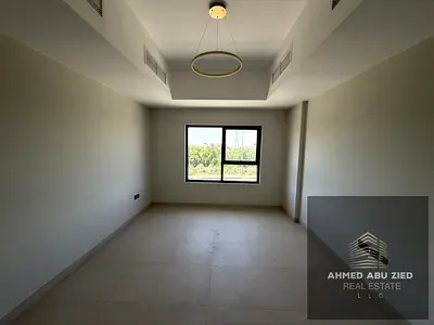 2BR apartment with hall, first tenant, in Kentia Al Zahia Ajman. Includes parking, gym, pool, and road view. Rent AED 45K, 4 cheques, cash deposit.