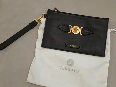 Versace black leather clutch/wristlet with gold Medusa medallion