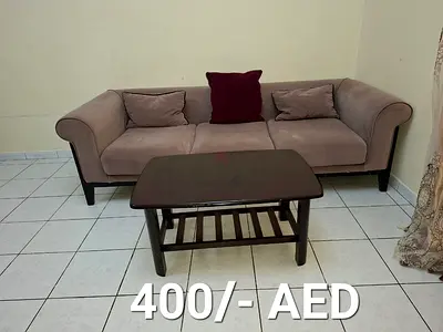 3-seater beige fabric sofa with small coffee table - good condition