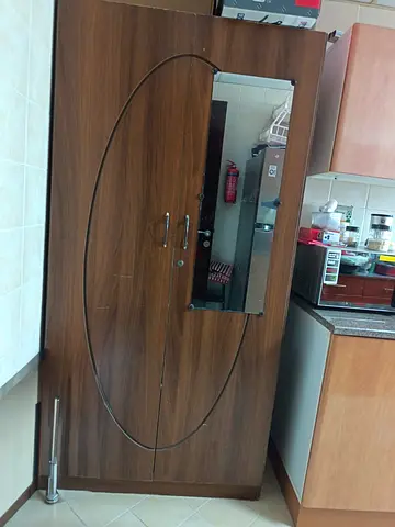 2 Door storage cupboard with fixed mirror for immediate sale