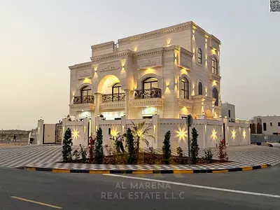 Luxury villa for sale in Al Zahia - Ajman | Corner of two streets with a large setback | Two floors + roof | Land area 3,800 sq ft | Built-up area 5,4