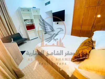 For monthly rent in Al Khor Towers, Ajman a furnished one-bedroom apartment with a living room two bathrooms and a balcony