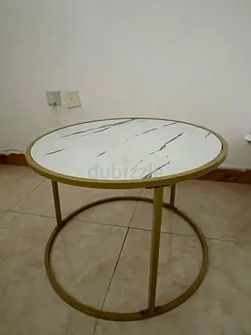 Round marble-top side table with gold metal frame
