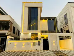 A villa with a luxurious European design, an elegant modern facade, natural stone, panoramic glass, 