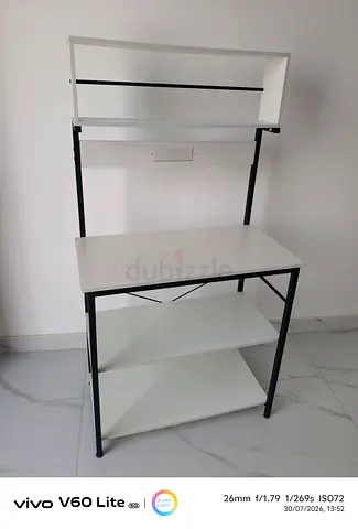 Compact white study desk with overhead shelf and storage