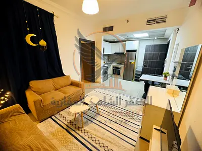 Furnished studio apartment for monthly rent with gym and pool access, including bills, in Al Rashidiya Clock Tower 1. Prime location near Safeer Mall