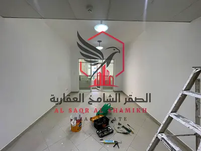 The most beautiful sea view with a balcony for a two-bedroom apartment, living room, and storage room in the finest towers of Sharjah
