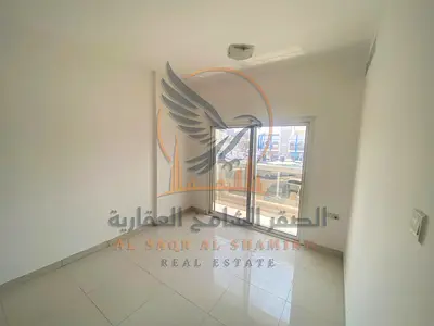 For annual rent in Al Nuaimiya 2 Ajman a one-bedroom apartment with a living room two bathrooms and a balcony Excellent space Clean