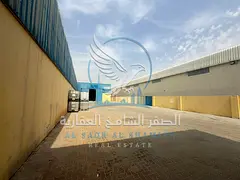 Yard for rent in Industrial Area 18, located on a main road, featuring offices and a covered warehou