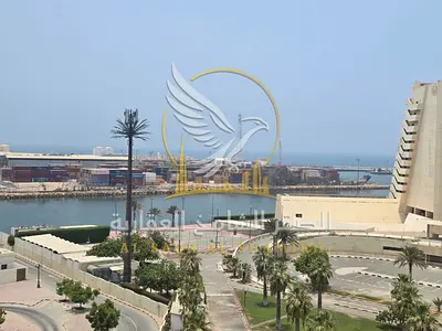For Rent Two bedroom apartment with a living room in Al Majarah Balcony with a sea view Spacious layout Modern finishing Distinctive building