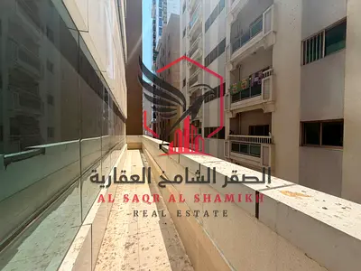 The most beautiful view with a balcony, one month free — a two-bedroom master apartment with a living room in the finest towers of Sharjah.