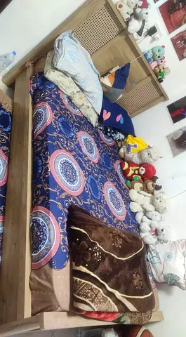 Single wooden bed frame with headboard without mattress