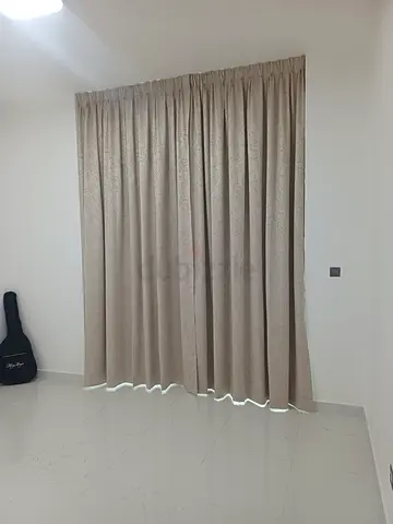Beige blackout curtains with white sheer - set for balcony window