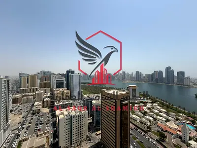 5BR + living room in Al Majaz 1, free AC & parking, all master rooms, balcony with sea view. Prime lively location near services and Dubai exit.