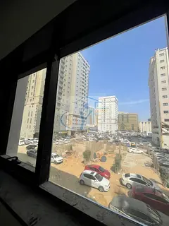 Two-bedroom apartment with a living room, brand new with one month free, in Al Nuaimiya 2 | Next to 