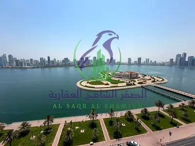 Two bedroom apartment with living room for annual rent in Al Majaz 3 Sharjah free air conditioning free parking maintenance included maid room built i