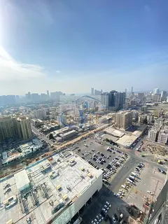 One bedroom and living room for sale in Al Waha Towers. Closed kitchen.