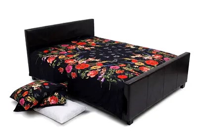 Double brown faux leather bed frame with mattress and bedding