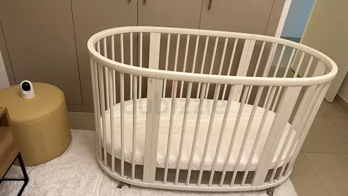 Modern stokke oval wooden baby crib - light wood, good condition