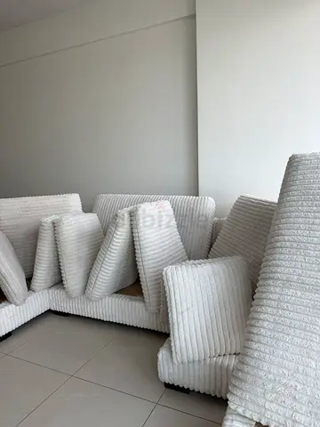 White Corduroy Corner Sofa with Multiple Cushions - Good Condition