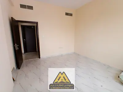One-bedroom apartment for annual rent in Al Jurf 2, Ajman Balcony with open views | Central air con