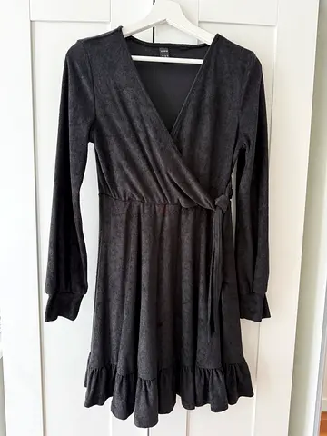Black long sleeve wrap dress with ruffle skirt - size M