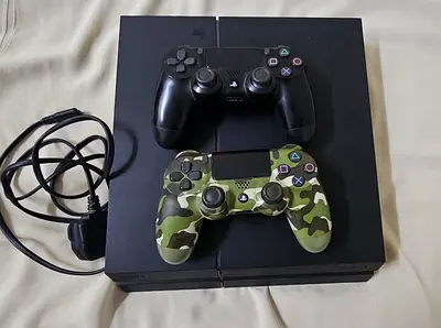 Sony PS4 Slim with 2 DualShock Controllers (Black + Camo)