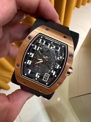 This is a Richard Mille RM 67-01 in rose gold, featuring a black rubber strap and a skeletonized dia