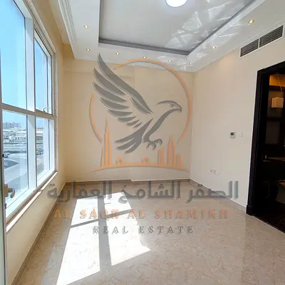 For annual rent in Ajman a two-bedroom apartment in Al Rawda 3 featuring two bathrooms a balcony with a view modern finishes excellent space private