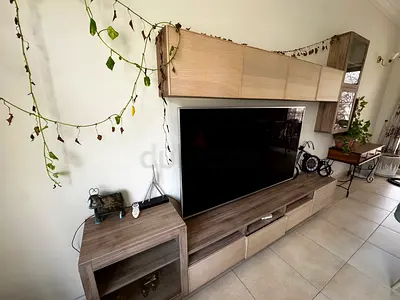Modern wall-mounted entertainment center with storage (wood finish)