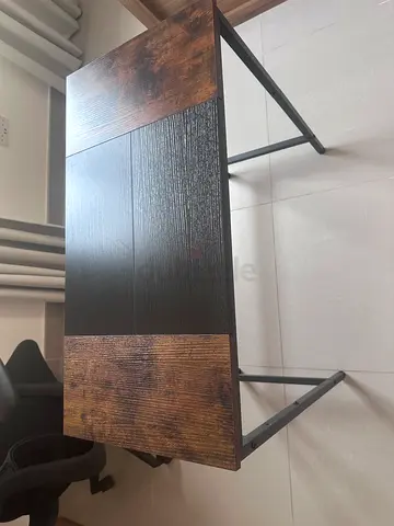 Compact industrial-style study desk with wood top and metal frame