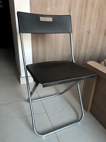 IKEA Simple metal folding chair with black seat and backrest AED 25