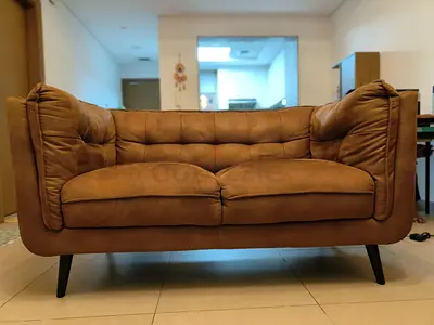 2-seater brown leatherette sofa in good condition