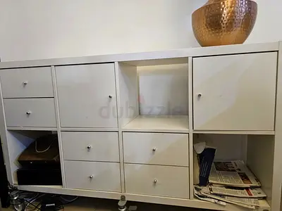 White modular storage cabinet with wheels, drawers and shelves