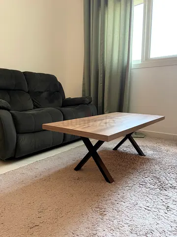 Wooden coffee table with X-frame metal legs