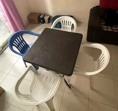Used plastic folding table with 4 outdoor chairs